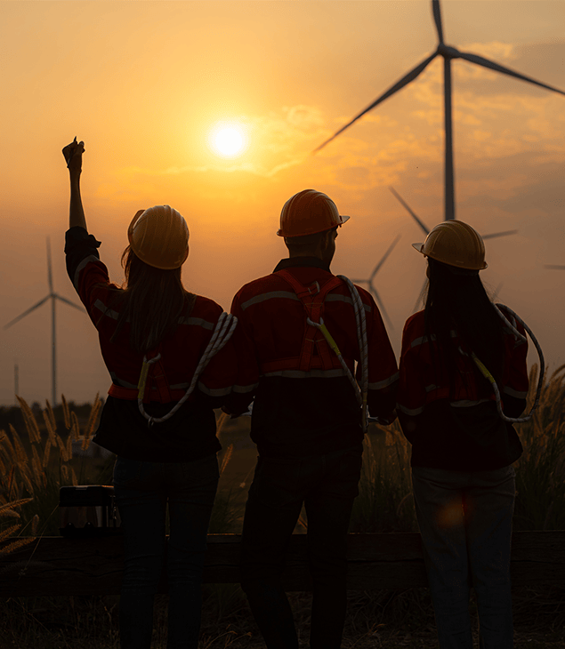 730x635 workers wind turbines celebration positive outcomes 